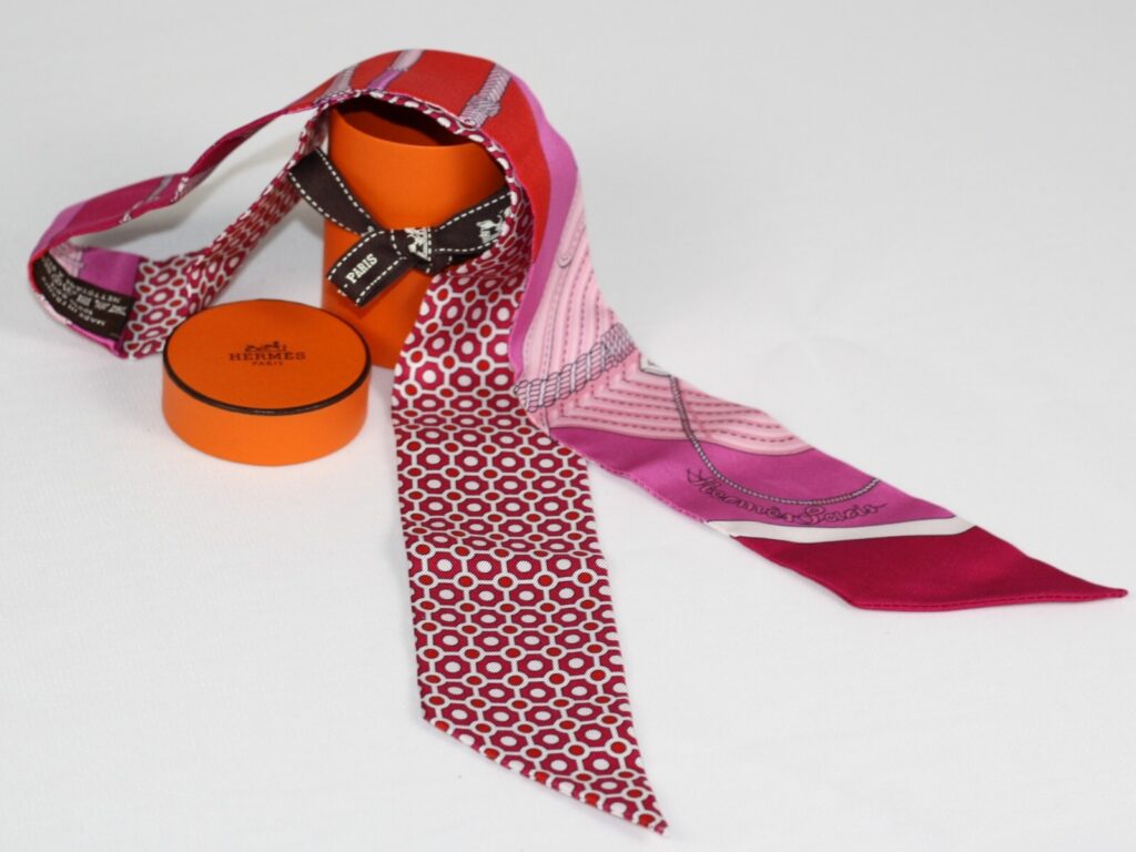 Hermès Twilly Silk Scarf – Pink, Red & Purple Geometric Equestrian Print